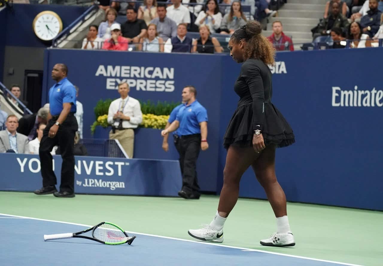 Serena Williams of the US smashes her racquet while playing against Naomi Osaka.