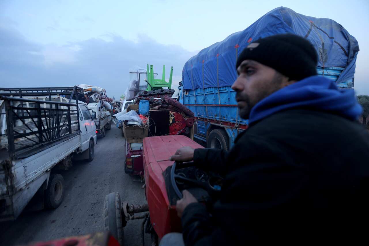 Civilians flee a Syrian military offensive in Idlib province, Syria.