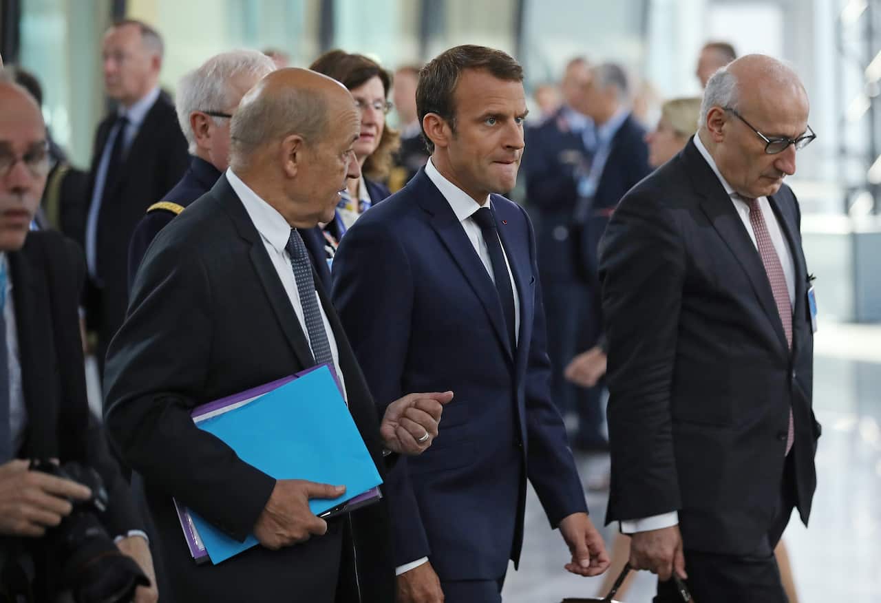 French President Emmanuel Macron arrives for a working session of NATO leaders in Brussels.