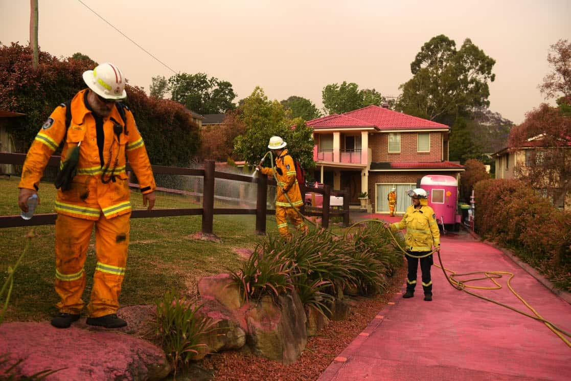 Chemical fire retardant is seen after being dropped to protect houses on Canoon Rd and Barwon Avenue South Turramurra, north of Sydney, Tuesday, 12 November 