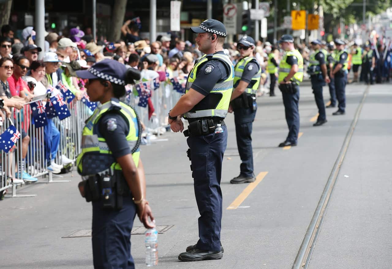 Police keep eye on the crowd for the Australia Day parade down Swanston Street in Melbourne, Friday, January 26, 2018