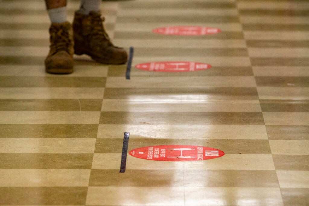 Australian supermarkets have implemented social distancing measures through stickers.