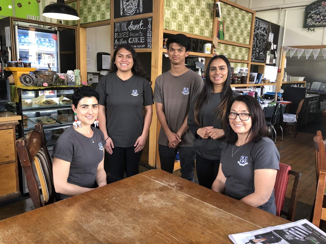 Nicole McRae, Precious Dennis, Rafael Billamer, Dilpreet Kaur and Amanda Joyce work together on Friday's at the cafe.