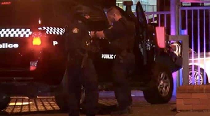 A man has been shot dead outside a western Sydney police station after he opened fire on officers with a shotgun, injuring one.