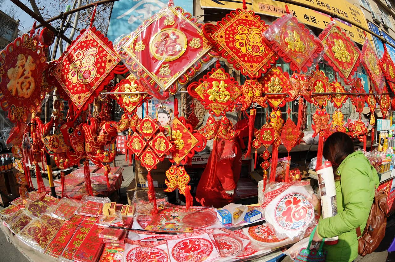 Chinese vendors sell Lunar New Year decorations at a market in Qingdao, in east China's Shandong province, on January 28, 2015. (AAP Image/NEWZULU/HAIBIN WANG)