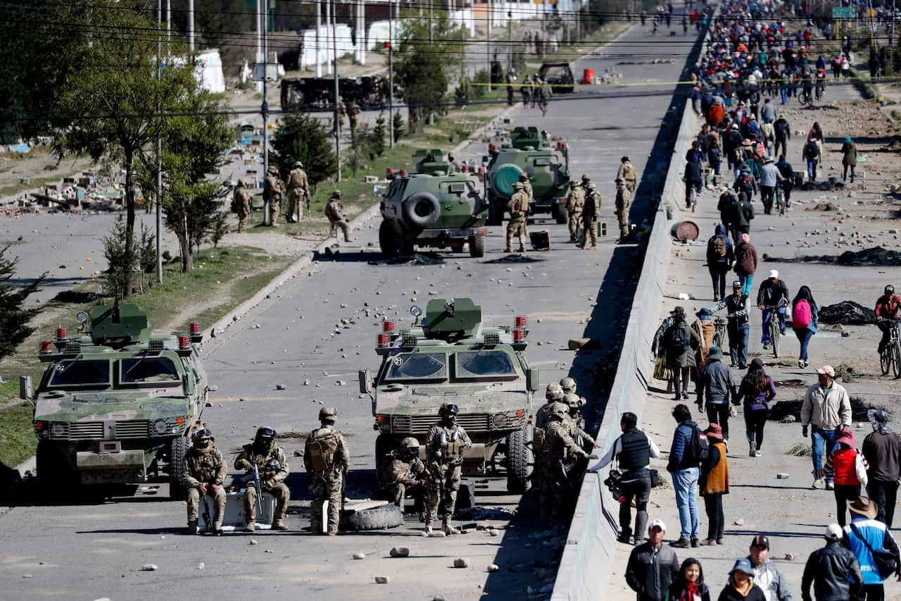 Soldiers guard the Senkata fuel plant on the outskirts of Bolivia.