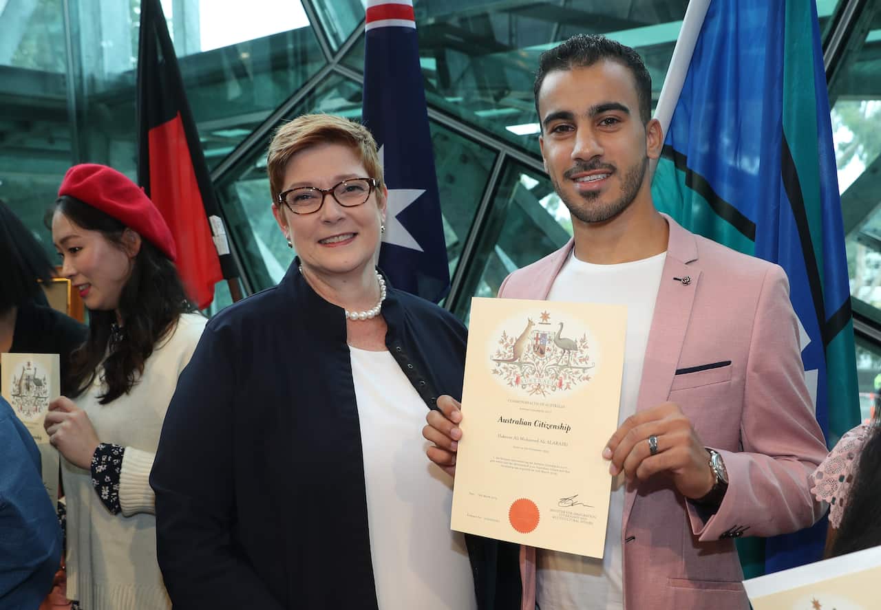 Minister for Foreign Affairs Marise Payne and refugee footballer Hakeem Al-Araibi at his Australian citizenship ceremony.