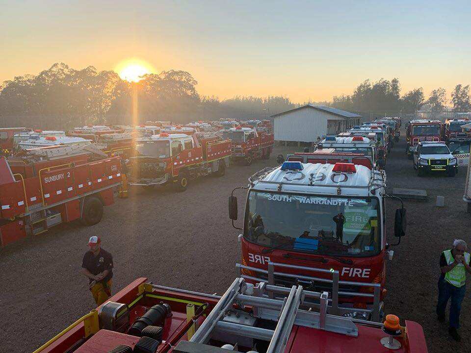 These firefighters rose with the sun to prepare for Tuesday's increased fire danger.