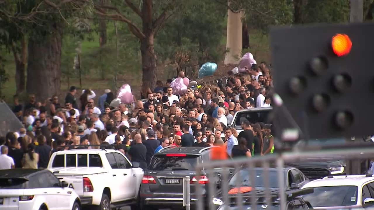 Hundreds gathered in the Sydney suburb of Oatlands to honour the four children killed in a car crash.