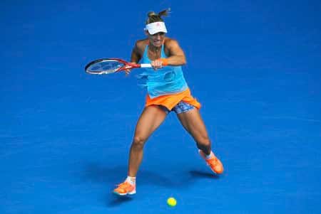 Kerber finds her rhythm to race into round four