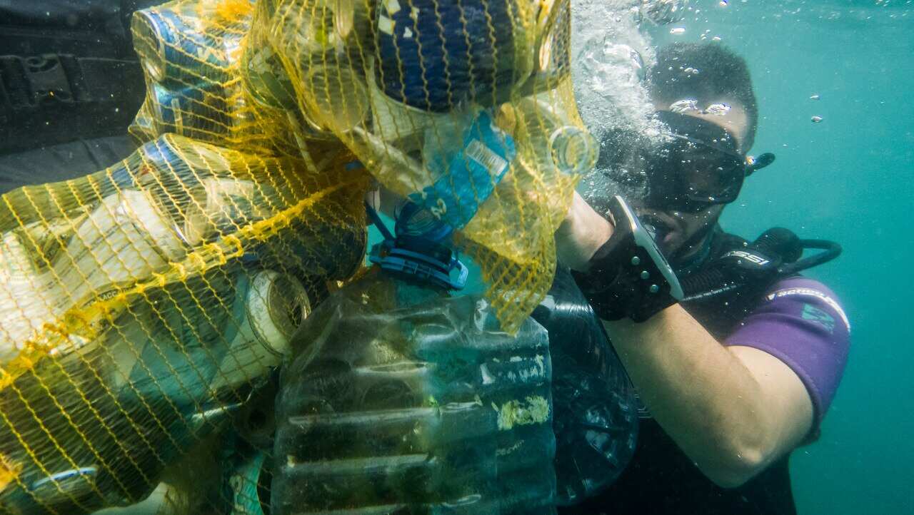 Plastic pollution is cleared from the sea along Beirut's Corniche.