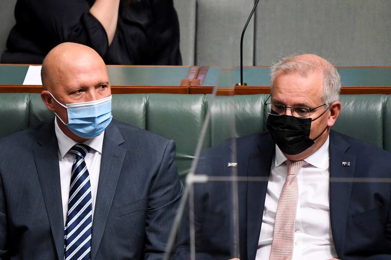 Defence Minister Peter Dutton and Prime Minister Scott Morrison during a vote on the firearms bill in Parliament House. 