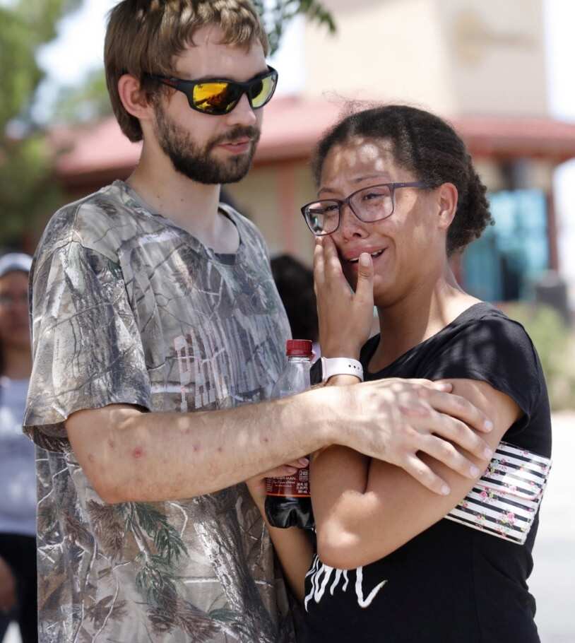 Kendall Long (L) comforts Kianna Long (R) who was in the freezer section of a Walmart during a shooting incident, in El Paso, Texas, USA, 03 August 2019.