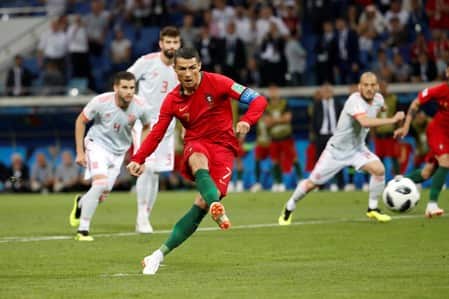 Magic Ronaldo lights up World Cup with hat-trick to deny Spain