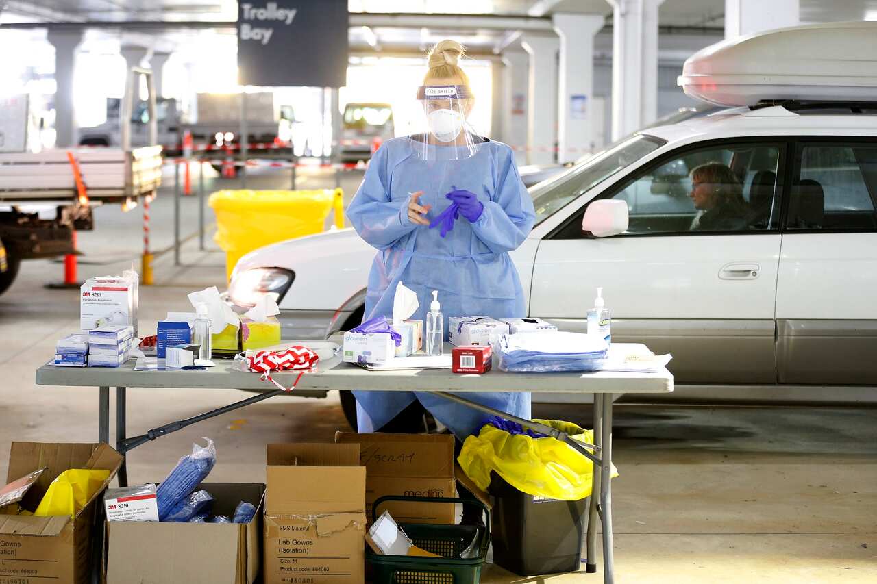 A medical practitioner prepares to administer a test