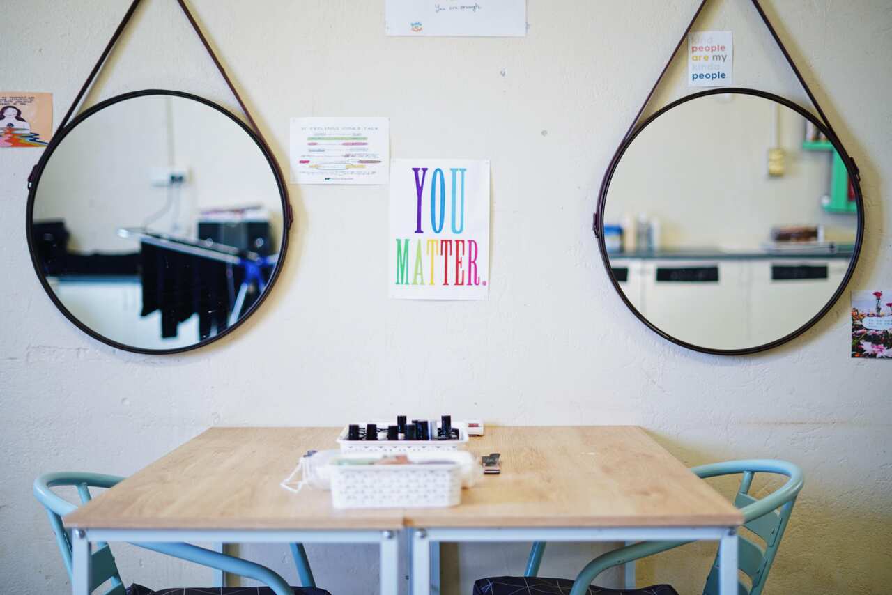 Ms Tilmouth says the salon is covered in inspirational and motivational messages to help with self-esteem and mental health.