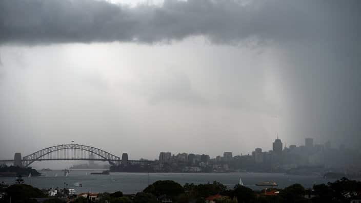 Storm clouds are seen gathering over Sydney.