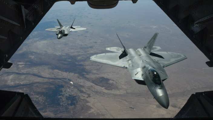 A handout photo made available by the US Department of Defense shows two US Air Force F-22 Raptors flying above Syria in support of Operation Inherent Resolve AAP