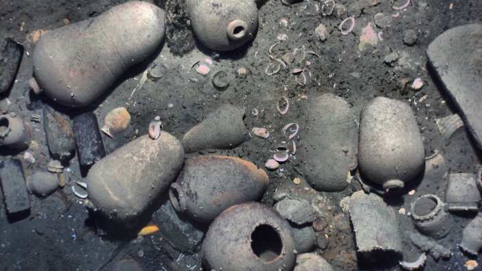 Ceramic jars and other items from the 300-year-old shipwreck of the Spanish galleon San Jose