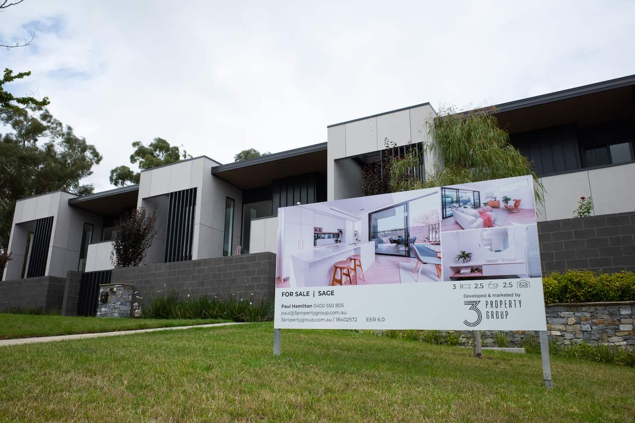 A sale sign is seen in front of a property in Canberra, Thursday, February 24, 2022. (AAP Image/Lukas Coch) NO ARCHIVING