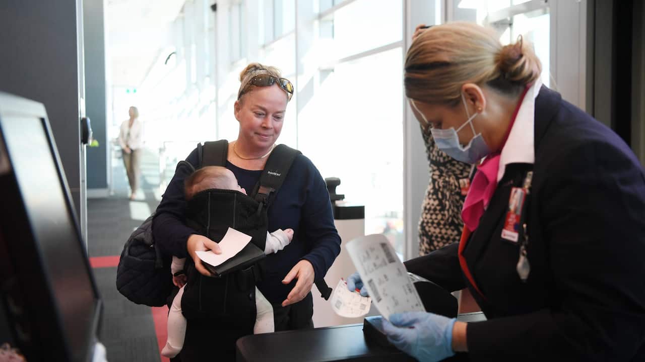 Passengers begin boarding the first Qantas flight between Sydney and Adelaide since COVID-19 border restrictions were lifted, Sydney Domestic Airport