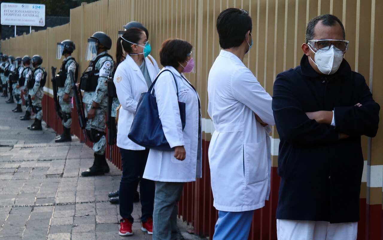 Medical personnel line up to be vaccinated against COVID-19 at the General Hospital in Mexico City.
