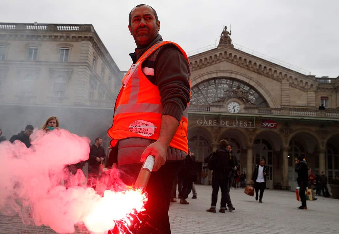 Passengers and commuters wait at rush hour at Gare de Lyon train station, in Paris.