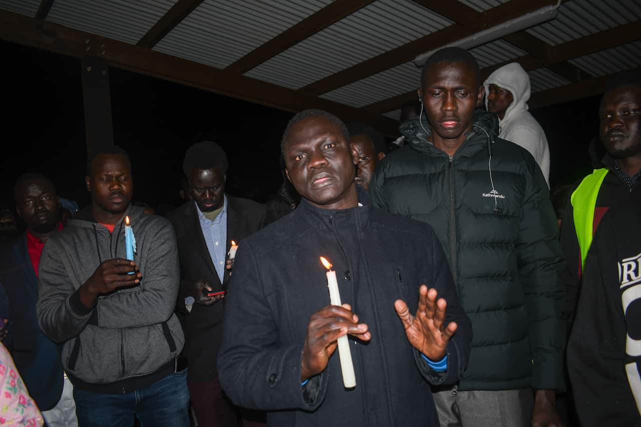 Members of Melbourne Lions team at the vigil