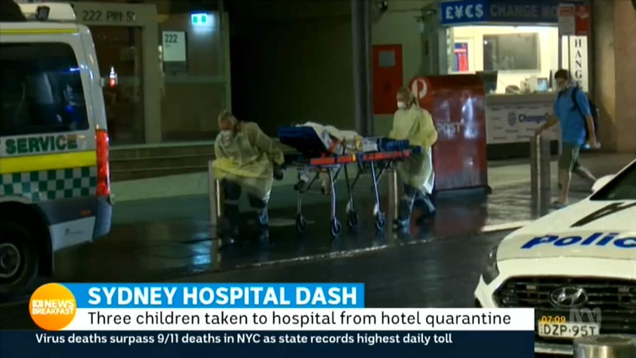 A child is taken from the Hilton Hotel in Sydney. (ABC)