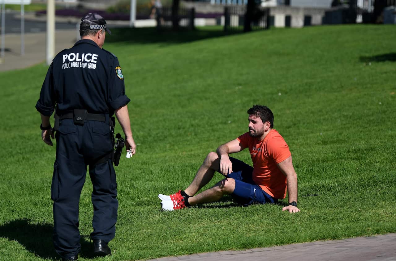 Police ask people to move along at Sydney's Bondi Beach.