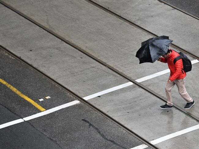 pedestrian under heavy rain