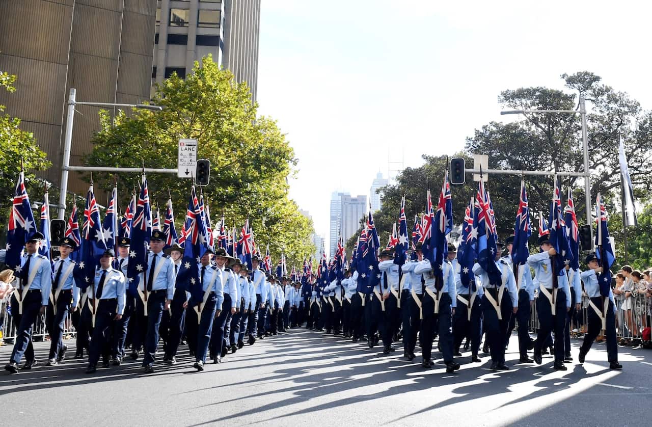 Flag bearers take part in the ANZAC Day March in Sydney on Tuesday, April 25, 2017. 