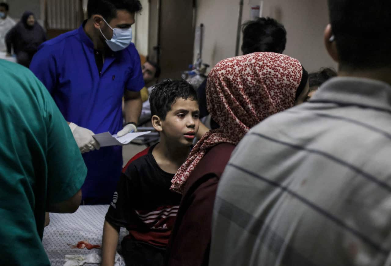 A Palestinian child  receives treatment at the Al-Shifa hospital after the death of family members in an Israeli air strike in Gaza City on 17 May, 2021.
