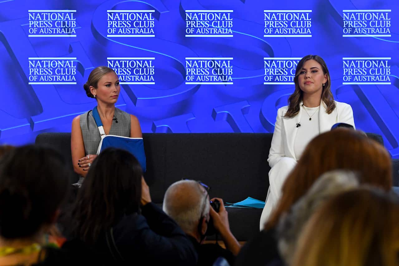 2021 Australian of the Year Grace Tame (left) and advocate for survivors of sexual assault Brittany Higgins address the National Press Club in Canberra, Wednesday, February 9, 2022. (AAP Image/Lukas Coch) NO ARCHIVING