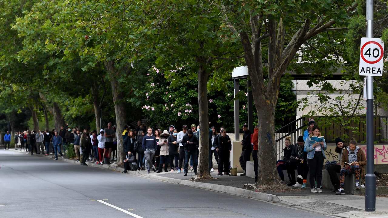 People are seen waiting in line at a Centrelink office (AAP)