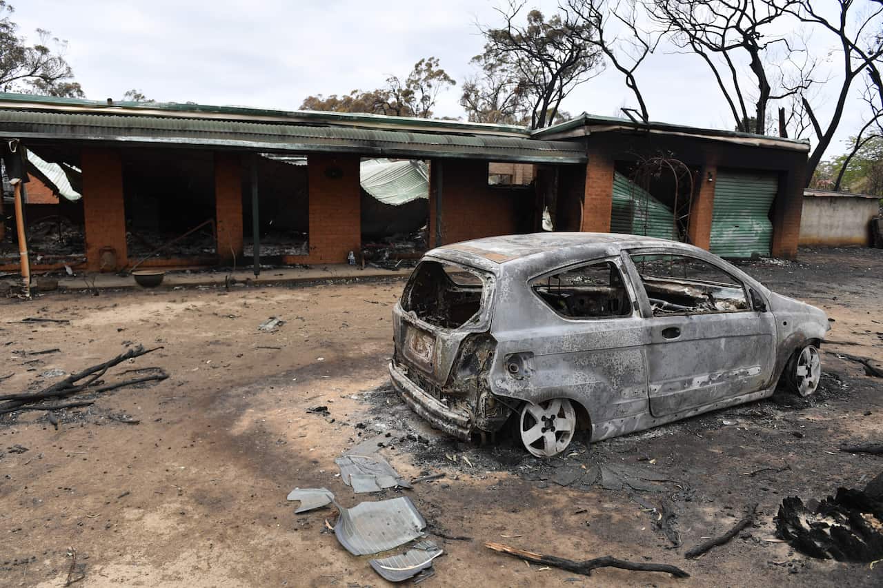 A house and car damaged by last Saturday's catastrophic bushfires in the Southern Highlands village of Balmoral.