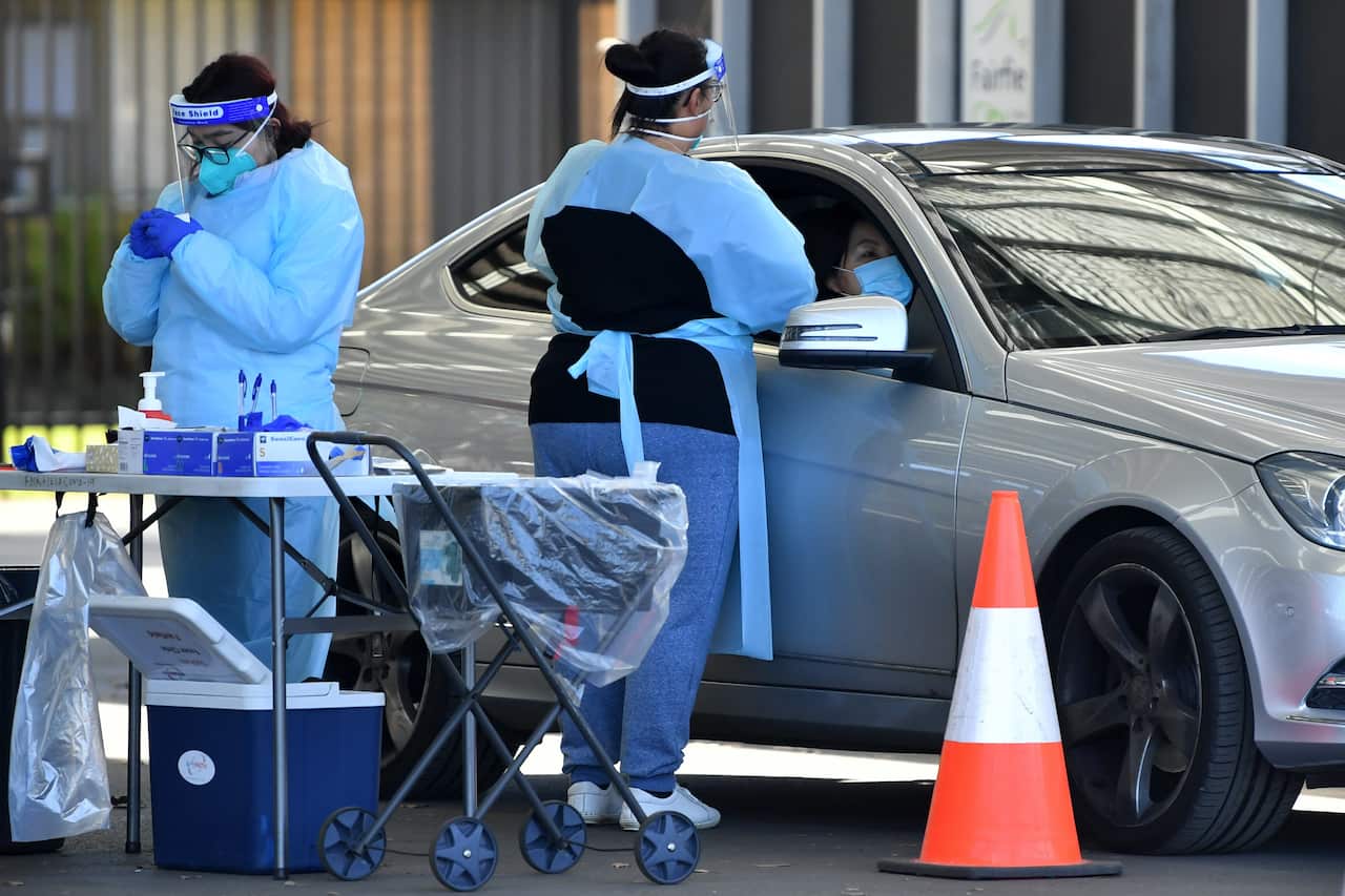 Members of the public are tested at a pop up COVID clinic at Fairfield in Sydney.