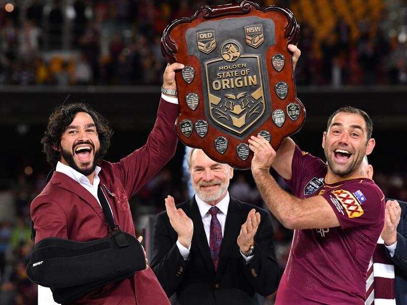 Johnathan Thurston, left, and Cameron Smith.