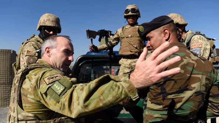 Australian Defence Force Colonel Andrew McBaron (2nd left) and Command Sergeant Major Muammad Ali Husanini (right) of the Kabul Garrison Command