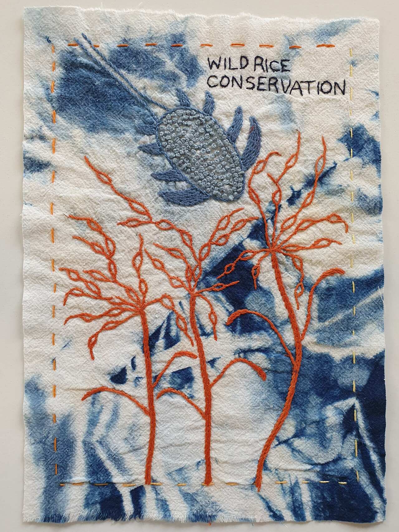 Alison McShanag's bloc depicts wild rice growing by the river.