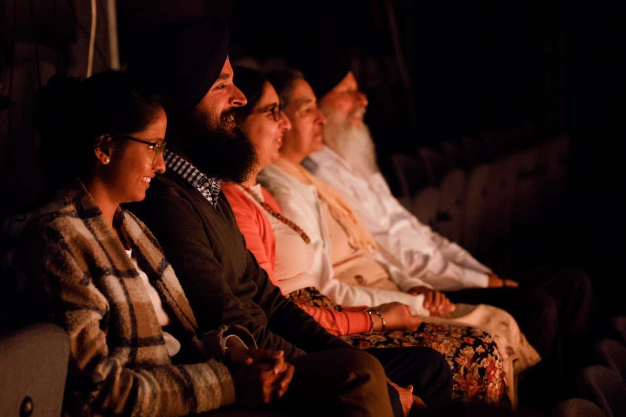 Mrs Amarjit Kaur, with other members of her family, enjoying Sukhjit's stage performance 