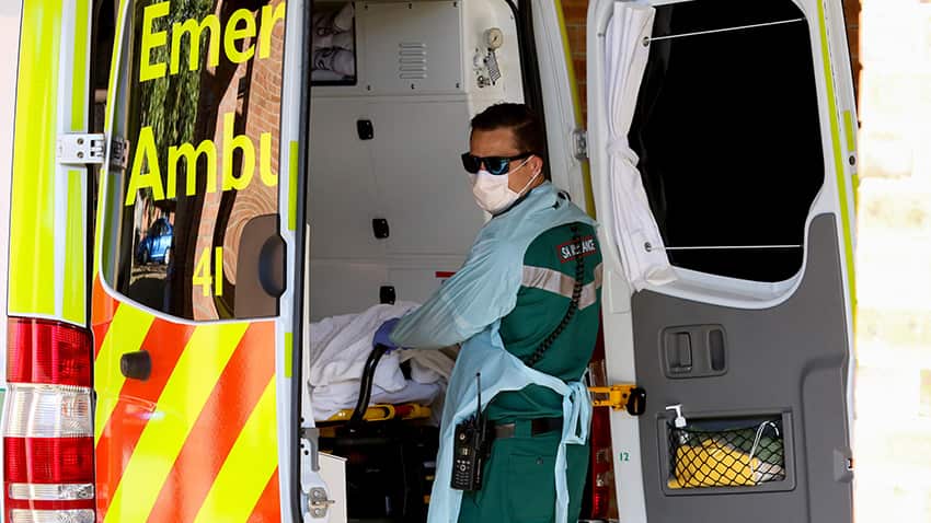 A paramedic wears protective clothing while outside the Mount Barker Hospital in Adelaide,