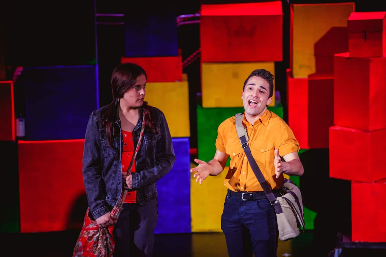 girl and boy on theate stage performing 