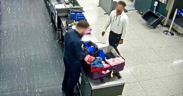 An ABF officer searching the Indian man's baggage soon after his arrival at Perth Airport