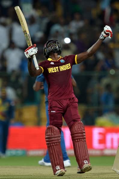 West Indies batsmen Andre Fletcher (R) gestures after winning the match 