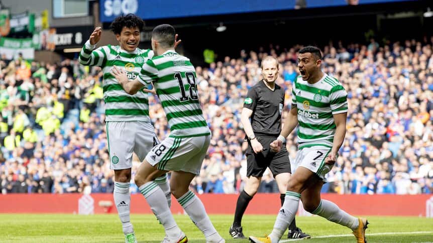 Tom Rogic (centre) celebrates scoring a goal for Celtic last month.