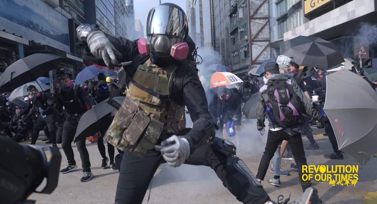 Protester wearing mask fighting for freedom on the street in Hong Kong