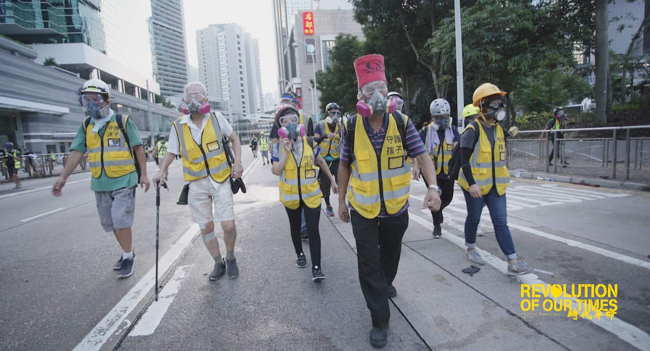 Elderly protester protect the youngster in the movement