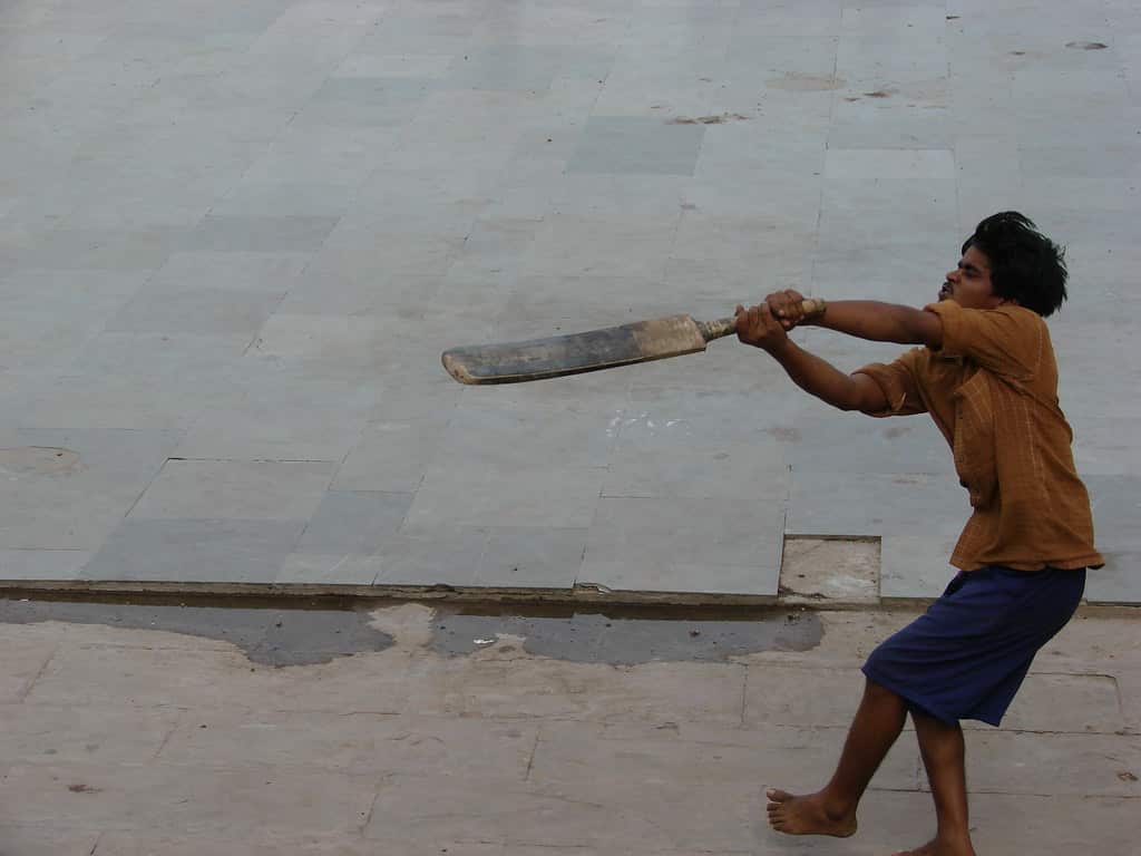 Whack! Playing cricket with freedom in the streets. 
