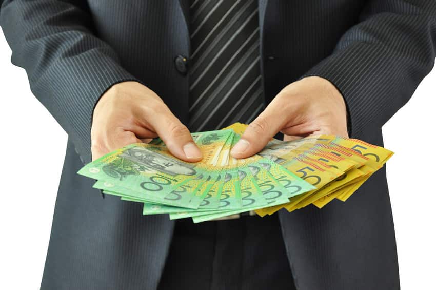 Businessman hands holding money